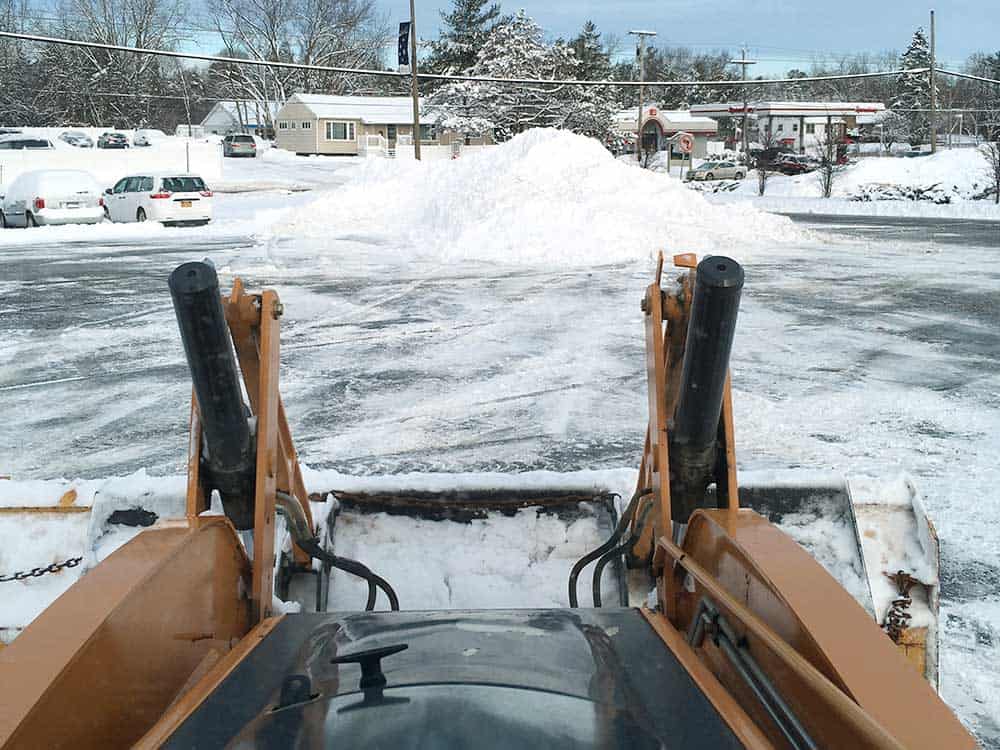 J&R offers snow plowing services for your parking lot