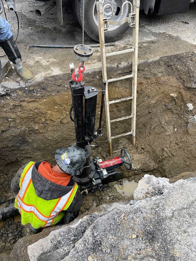 Tapping water main by J&R Contracting of Hudson, NY